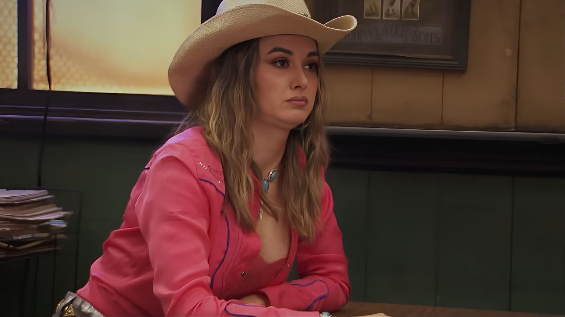 A scene from It's Always Sunny in Philadelphia season 17 featuring the new character C*ck Chewa, who appears in a pink cowboy outfit during one of the season’s eccentric storylines. (Image via FX Networks)
